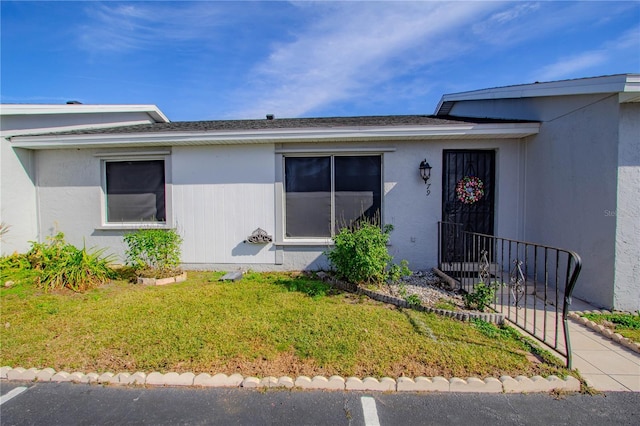 79 Lake Villa Way, Kissimmee, FL 34743 - doorway to property with a lawn