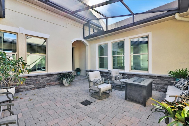 view of patio featuring a lanai