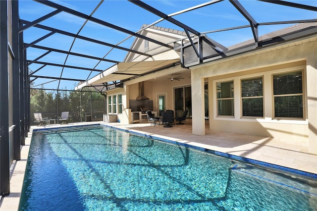 view of swimming pool featuring a patio, ceiling fan, and a lanai