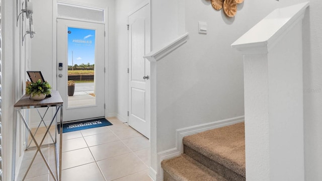 entryway with light tile patterned floors