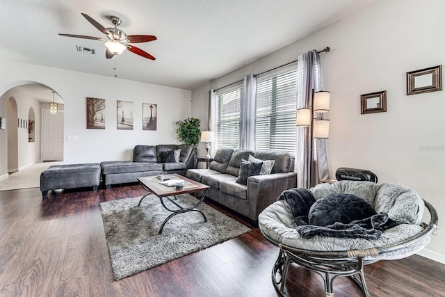 living room with hardwood / wood-style floors and ceiling fan