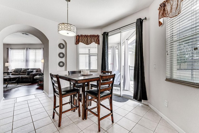 dining area with light tile patterned floors