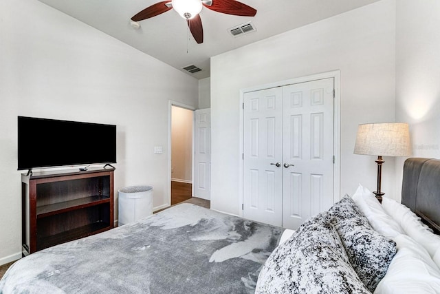 bedroom with ceiling fan and a closet