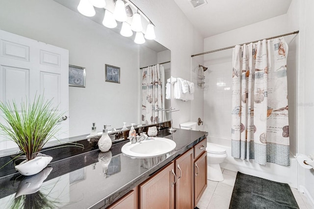 full bathroom featuring tile patterned floors, vanity, shower / bath combination with curtain, and toilet