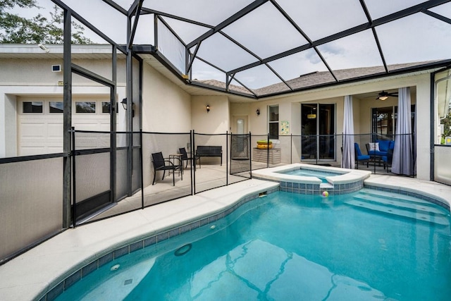 view of pool featuring glass enclosure, an in ground hot tub, and a patio