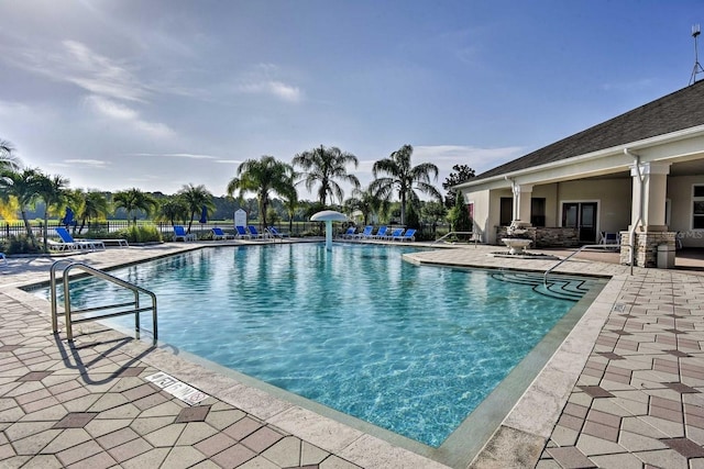 view of swimming pool with a patio area