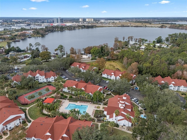 birds eye view of property with a water view