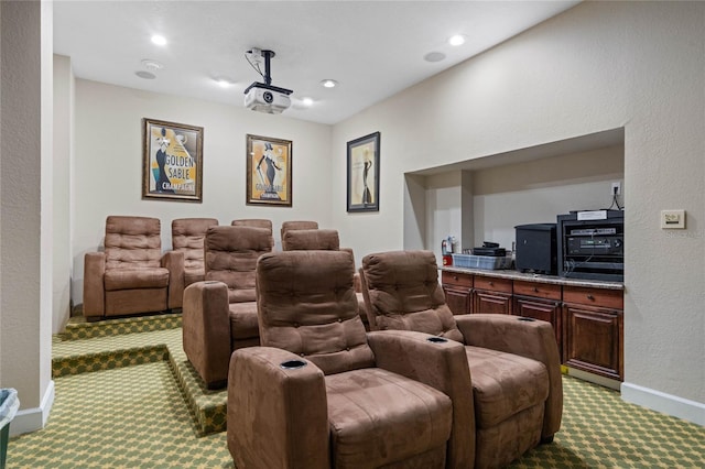 home theater room featuring light colored carpet