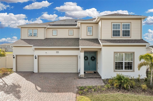 4360 Sunset Preserve Blvd, Orlando, FL 32820 - view of front facade with solar panels and a garage