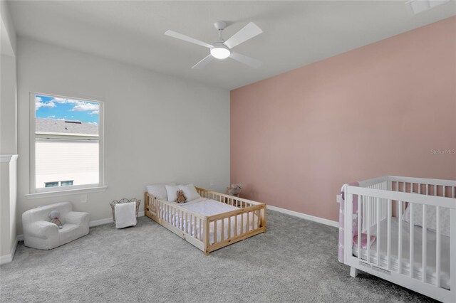 4360 Sunset Preserve Blvd, Orlando, FL 32820 - bedroom with carpet flooring, ceiling fan, and a nursery area