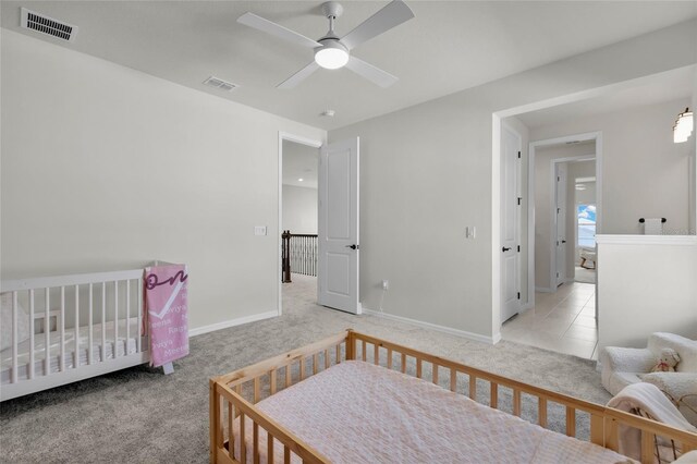 4360 Sunset Preserve Blvd, Orlando, FL 32820 - carpeted bedroom featuring a nursery area and ceiling fan