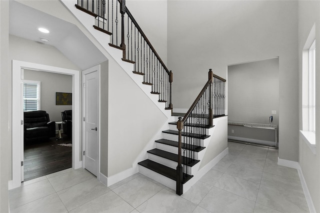 stairs featuring tile patterned flooring