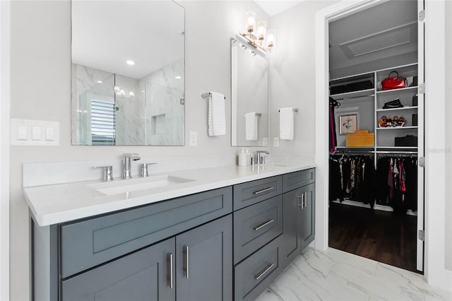 bathroom featuring vanity and a shower with door