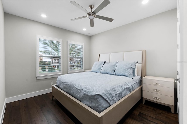 bedroom with ceiling fan and dark hardwood / wood-style floors