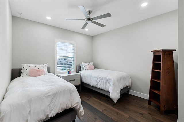 bedroom with ceiling fan and dark hardwood / wood-style floors