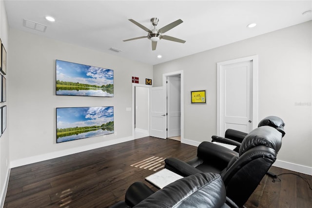 living room featuring ceiling fan and dark hardwood / wood-style floors