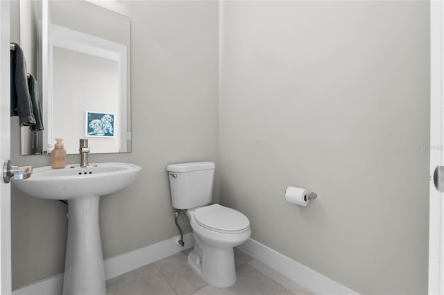 bathroom with tile patterned floors and toilet