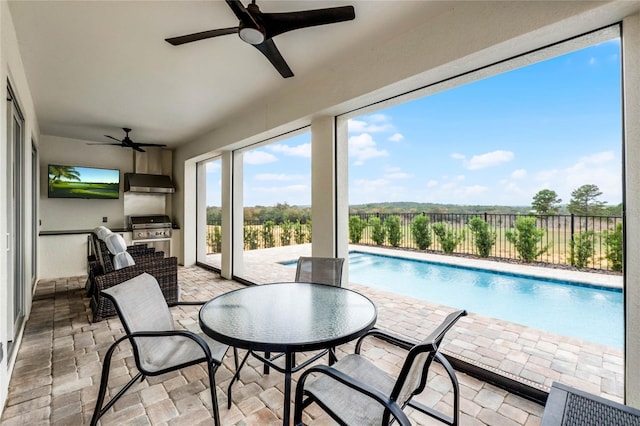 sunroom / solarium with ceiling fan