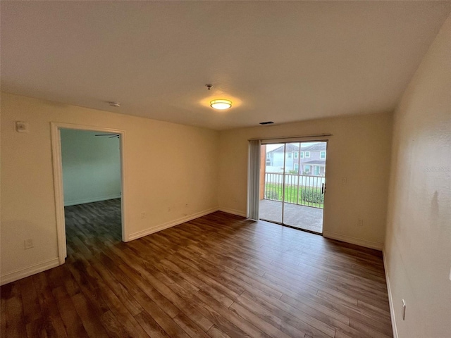 spare room with wood-type flooring