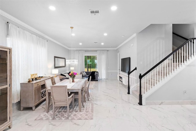 dining room featuring crown molding