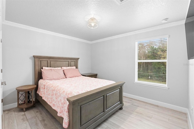 bedroom featuring light hardwood / wood-style flooring, multiple windows, and crown molding