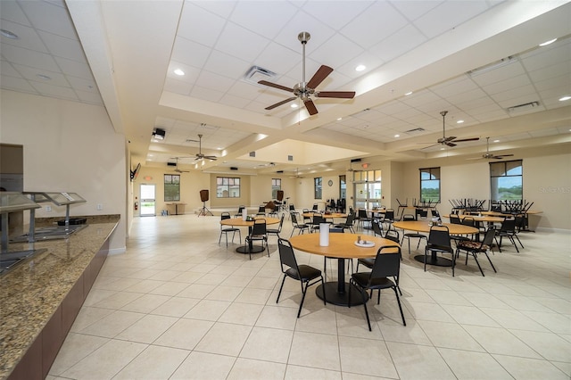 dining space featuring light tile patterned floors, a paneled ceiling, and ceiling fan