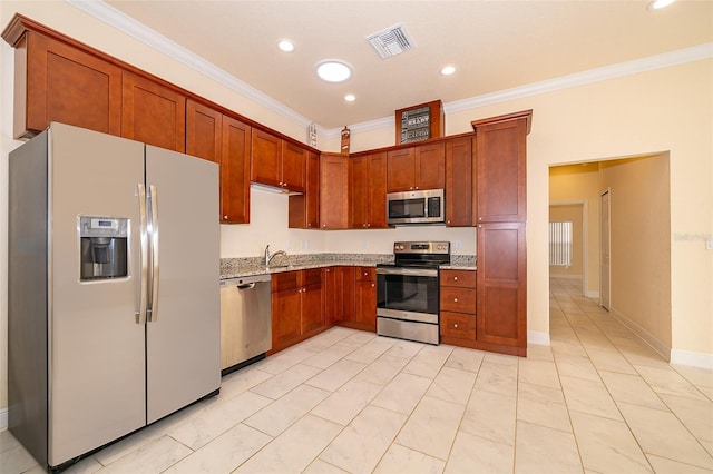 kitchen featuring light stone countertops, sink, ornamental molding, and appliances with stainless steel finishes