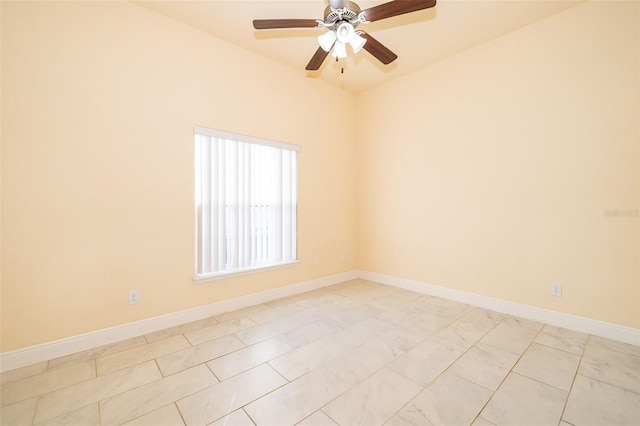 empty room featuring ceiling fan and light tile patterned floors