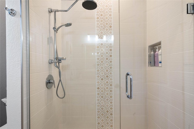 bathroom featuring an enclosed shower