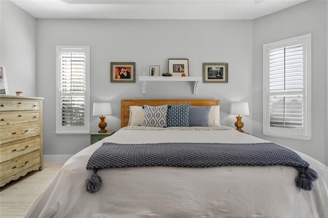 bedroom with light hardwood / wood-style floors