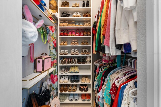 spacious closet featuring tile patterned flooring