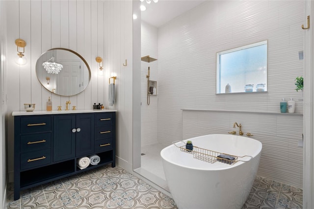 bathroom with tile patterned flooring, shower with separate bathtub, and vanity