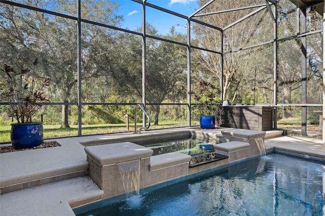 view of swimming pool featuring a lanai, pool water feature, and a jacuzzi