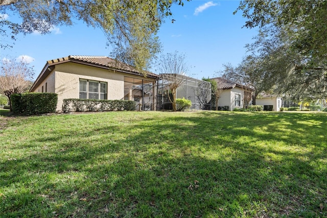 view of front facade featuring a lanai and a front yard