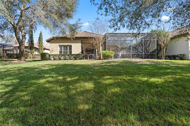 view of yard featuring glass enclosure