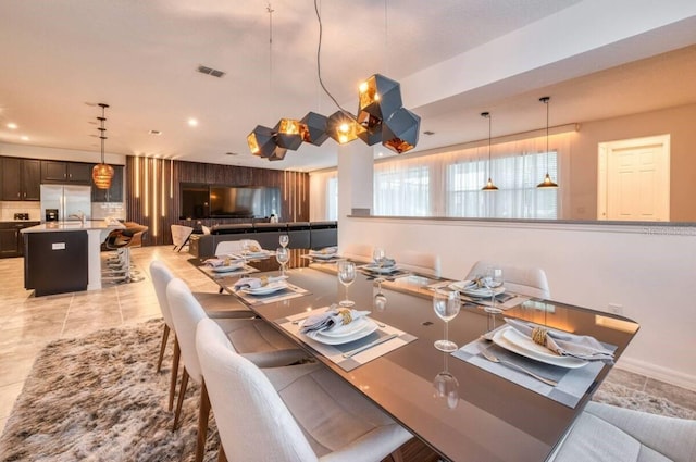 dining area featuring light tile patterned flooring