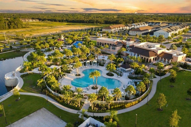 aerial view at dusk with a water view