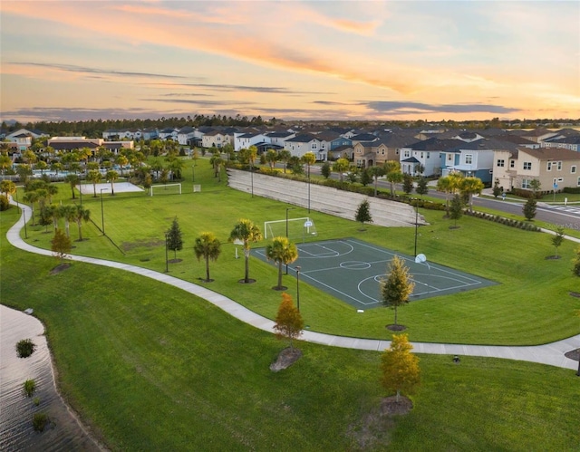 view of home's community with basketball hoop