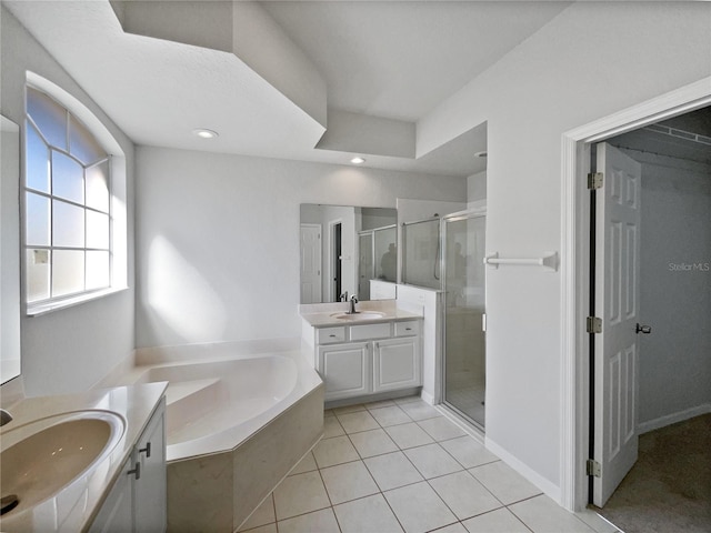 bathroom featuring tile patterned flooring, vanity, and independent shower and bath