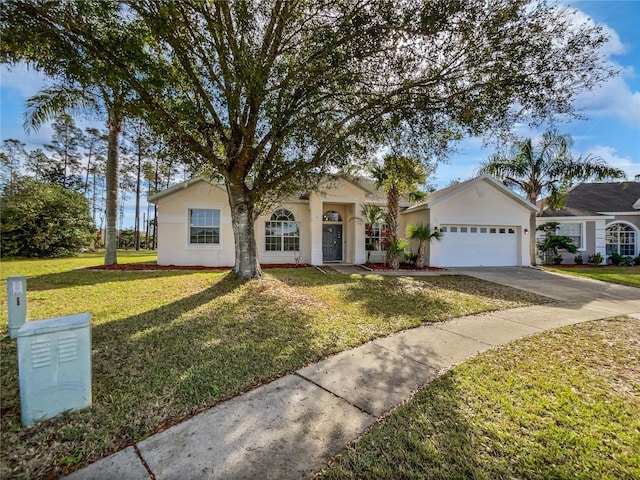 single story home with a front yard and a garage