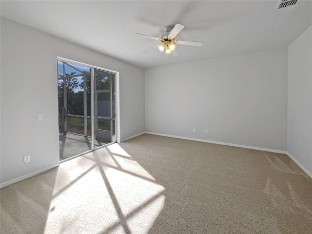 empty room featuring carpet flooring and ceiling fan