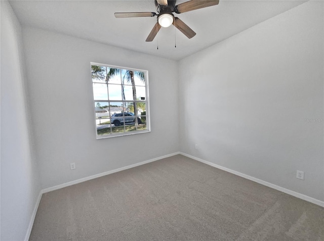 carpeted empty room with ceiling fan