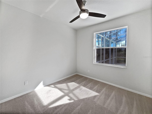 spare room with carpet flooring and ceiling fan