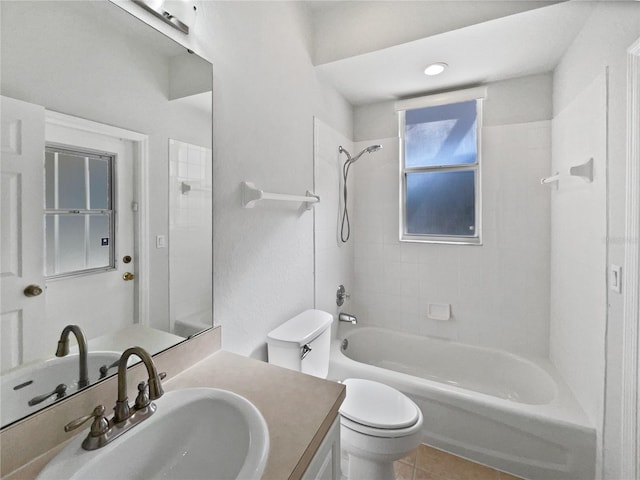 full bathroom featuring tile patterned floors, vanity, toilet, and tiled shower / bath combo