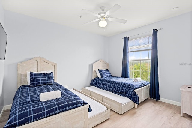 bedroom with hardwood / wood-style flooring and ceiling fan