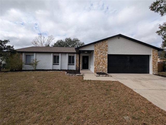 ranch-style home with a front yard and a garage