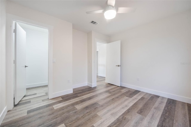 unfurnished bedroom featuring light hardwood / wood-style flooring and ceiling fan