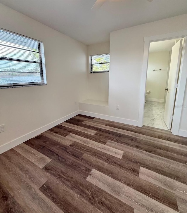 empty room featuring dark wood-type flooring