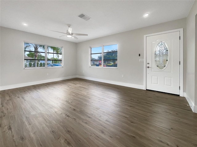 foyer with ceiling fan and dark wood-type flooring