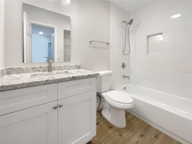 full bathroom featuring vanity, shower / bathing tub combination, wood-type flooring, and toilet